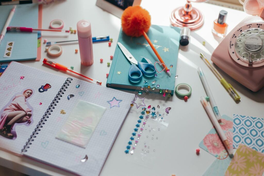 A vibrant workspace filled with crafting materials, stationery, and decorative items promoting creativity.